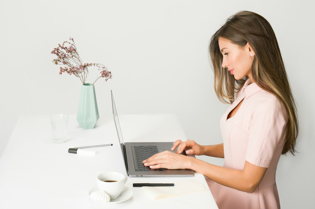 mystery writer typing at desk