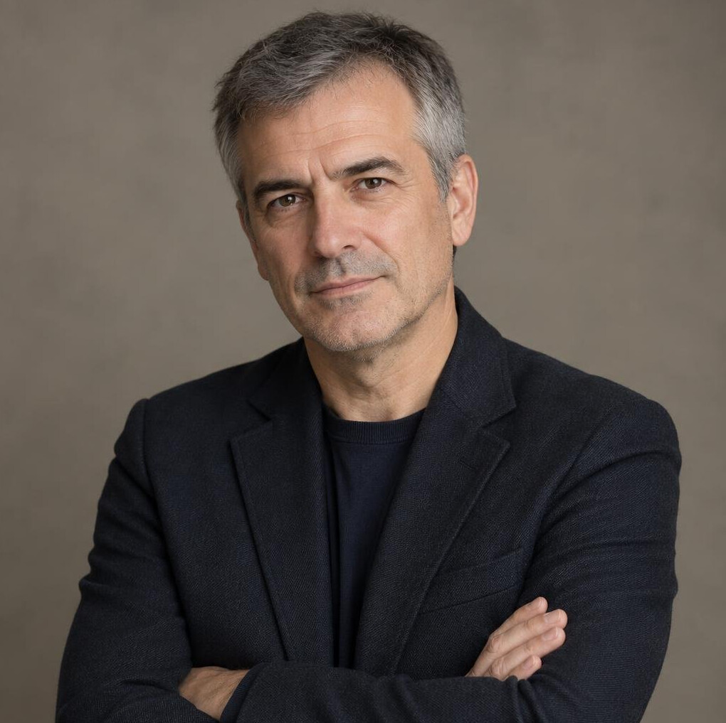 Studio portrait of a middle-aged Croatian male mystery novelist wearing a dark blazer